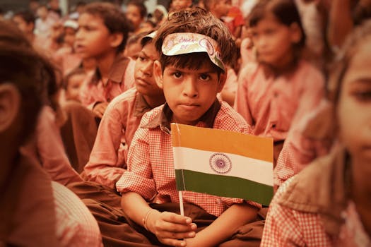 Children in Mathura, India celebrating Independence Day with Indian flags.