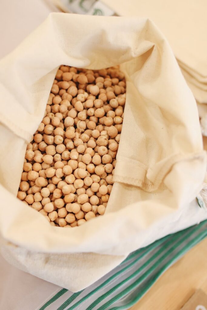 Eco-friendly shopping with reusable sacks filled with chickpeas for a zero waste lifestyle.